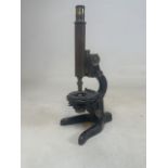 A military issue mid 20th century horse shoe based microscope, with broad arrow stamp. H:43cm