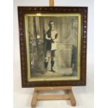 A 1930's footballer in oak frame with gilt rebate. frame size W:53cm x H:63cm