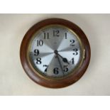 A MAHOGANY CIRCULAR DRUM CASED WALL CLOCK, the 30cm circular silvered dial supporting a fusee