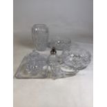 A collection of cut glass items to include a five piece dressing table set, a flower horn and others