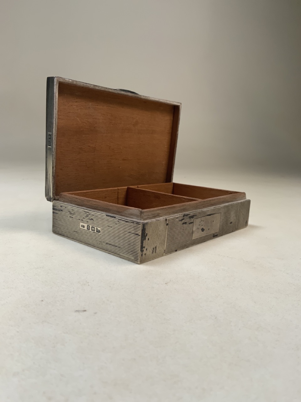 A sterling silver cedar lined cigarette box with engine turned decoration by John Rose Birmingham
