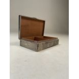 A sterling silver cedar lined cigarette box with engine turned decoration by John Rose Birmingham