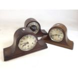 Three dome top, eight day mantle clocks in mahogany cases.