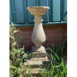 A stone pedestal bird bath or planter. H:69cm