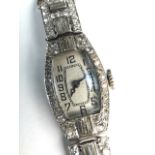 A precious white metal and diamond set cocktail watch on seed pearl set bracelet strap,.