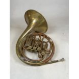 A french-horn by John Grey & Sons. Made in Italy. With a bag of extras.