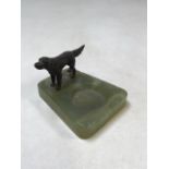 An onyx ashtray with a bronze statue of a dog W:9cm x D:11cm x H:7cm
