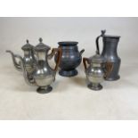 A collection of metalware to include pewter vase and jug plus three white metal coffee, tea pots and