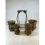 Four metal lion footed painted plant pots and a metal plant stand. W:29cm x D:29cm x H:31cm (largest