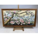 Framed oil on canvas of a magnolia. Indistinctly signed. W:109cm x H:58cm