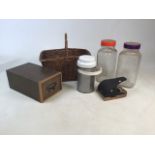 Two glass jars (one stamped Cadbury on the bottom), a wicker basket, Thermos, Criterion hole puncher