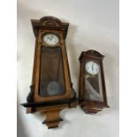 Two Vienna wall clocks also with a reproduction wall clock.