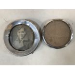 Two circular sterling silver photo frames. W:12cm x H:12cm W:10cm x H:10cm