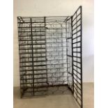 A mid century green painted metal double sided wine rack with doors W:108cm x D:53cm x H:163cm