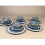A set of Five tea cups, saucers and tea plates in embossed Queensware design by Wedgwood of Etruria