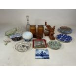 A collection of ceramic, glassware and elephant wooden bookends. To include display plates, glass