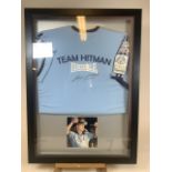 A framed and signed shirt by Ricky Hatton- Hitman Little Weigh Champion 2000. W:67cm x D:5cm x H:
