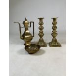 A pair of brass candlesticks together with a brass dish and oriental decorated teapot.