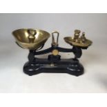 A set of Librasco scales with six weights. Weights range from 1LB to 1/2 ounce.