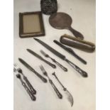 A collection of silver and silver plate items including a silver backed mirror and brush and a photo