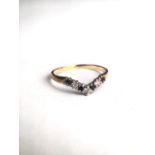 A 9ct gold, sapphire and diamond wish bone ring. 1.1g. Size N.