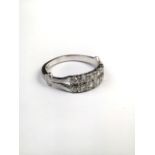 A platinum and diamond half eternity ring set with double line of brilliant cut diamonds. 4.8g. size