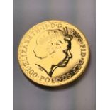 An Elizabeth II gold Britannia one hundred pound 1oz 999.9 fine gold coin in protective plastic