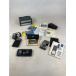 A collection of Psion personal organiser with charger and instruction manuals. Includes two Series