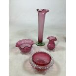 A collection of Four pieces of Cranberry glass. Chips to rim of one bowl H:36cm Height of vase