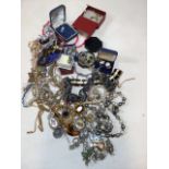 A collection of costume jewellery to include an Aynsley brooch, yellow metal necklaces, clip on