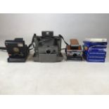 Three Polaroid cameras with Polaroid 600 and image system film, Camera include Polaroid SLR680