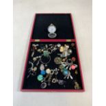 A box of costume jewellery and a modern pocket watch.