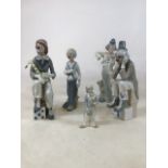 A collection of Lladro and Lladro style clowns