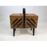 A wooden cantilever mid century sewing box. W:42cm x D:21cm x H:45cm