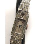A silver Art Deco cocktail watch set throughout with marcasite,