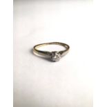 An 18ct gold and single stone diamond ring in an illusion setting. 1.5g. size J.5.