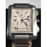 A gentlemans Cartier Tank 2303 stainless steel wrist watch. Quartz movement with 29mm case. Cabochon