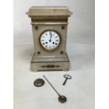 An onyx eight day mantle clock with gold metal decoration. Case in need of repair A/F