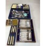 A collection of silver plated and metal cutlery. Some in original boxes
