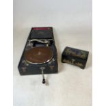 A Golf- Lecenced Odeon record player with a crank together with a Chinese lacquer music box