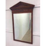 A reproduction pier mirror with bevelled edge and moulded frieze. W:55cm x H:100cm