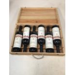 A wooden crate stamped Baron Philippe De Rothschild, S.A six bottles of Pauillac from 1995.