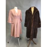 A 1940s dressed with embellished pockets with a mid century De Bella fur coat