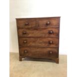 A Victorian mahogany chest of drawers with two short drawers over three long. With servants