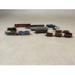 Three Graham Farish 00 Gauge plank wagons with two similar. Together with GWR 8198 00 gauge, Lima