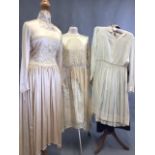 Three ivory dresses to include a square neck embellished front silk dress, a lace trimmed silk (
