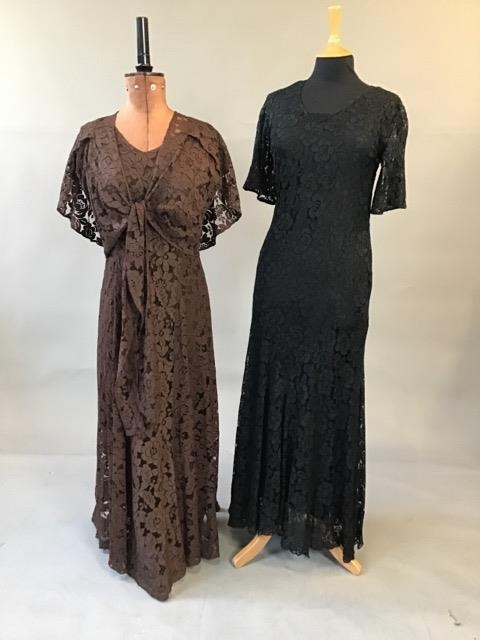 A 1930s brown lace gown with matching loose bolero jacket together with a 1930s black lace gown