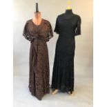 A 1930s brown lace gown with matching loose bolero jacket together with a 1930s black lace gown