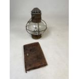 A copper hanging lamp and a 1930s leather clutch bag W:18cm x H:28cm Lamp dimensions