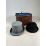 A large metal hat box also with a top heat and a bowler hat. W:40cm x D:32cm x H:29cm